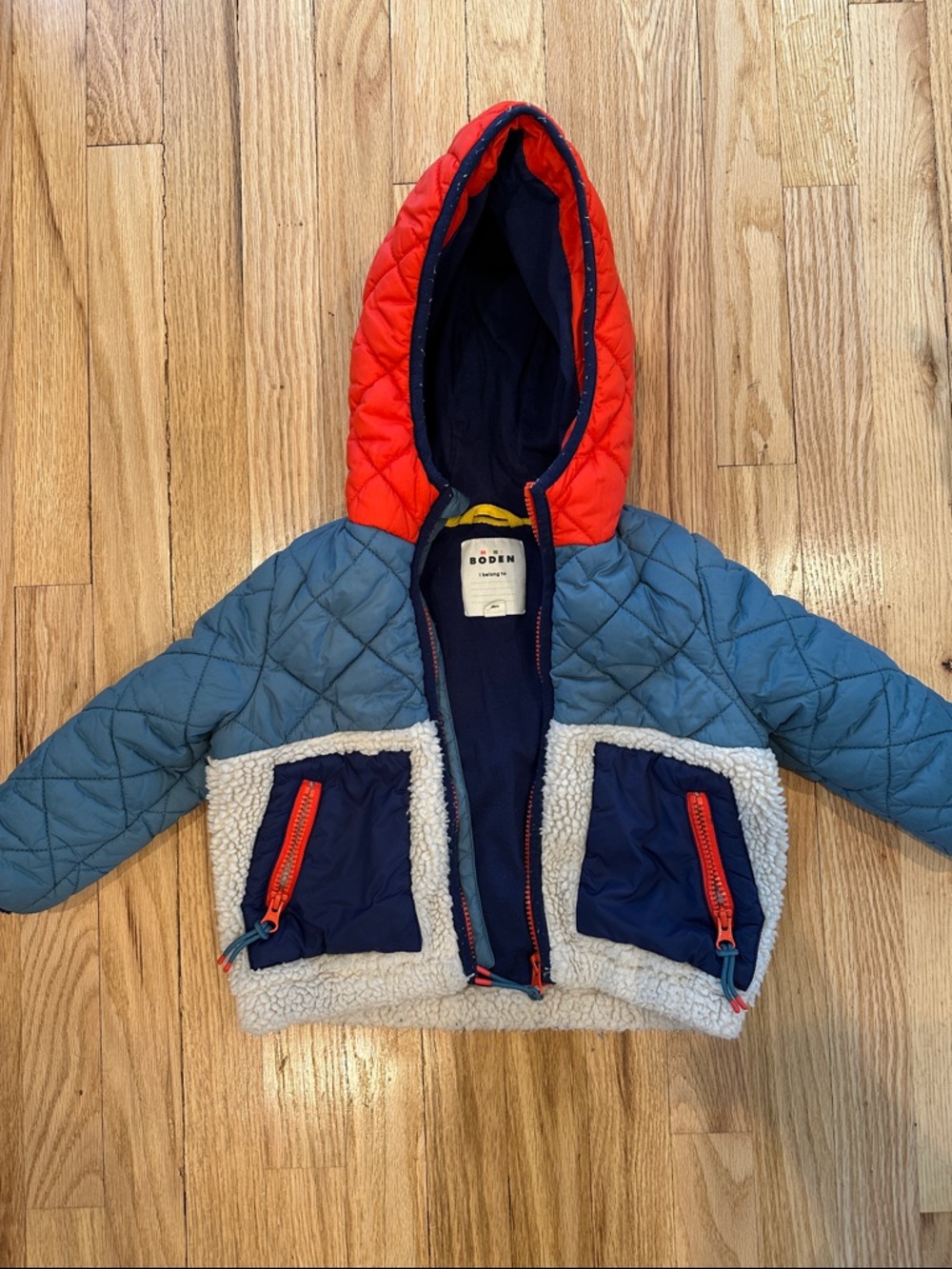 Boden Quilted Hooded Jacket in Blue, Red, and Navy